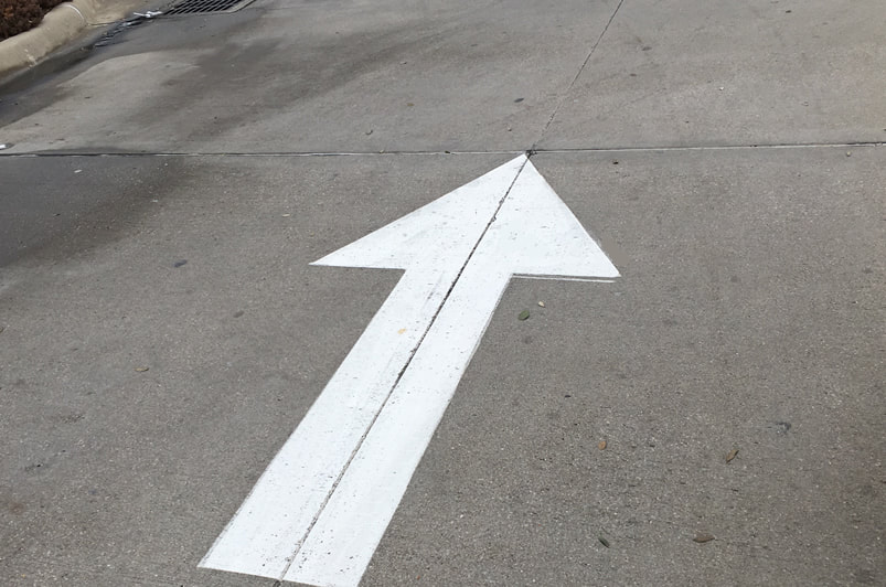 Directional Arrow Painted on Parking Lot in Denton